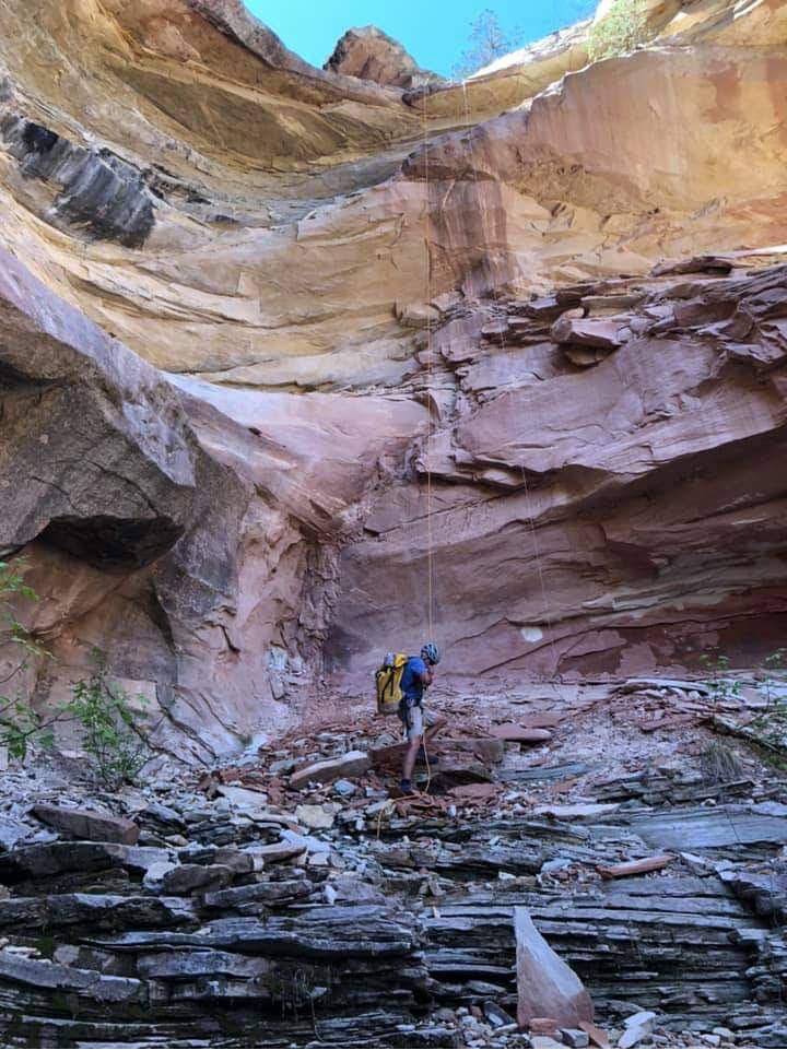 Climber taking himself off rope after rappelling from a 100ft rock ledge. Photo by Anne Linger.